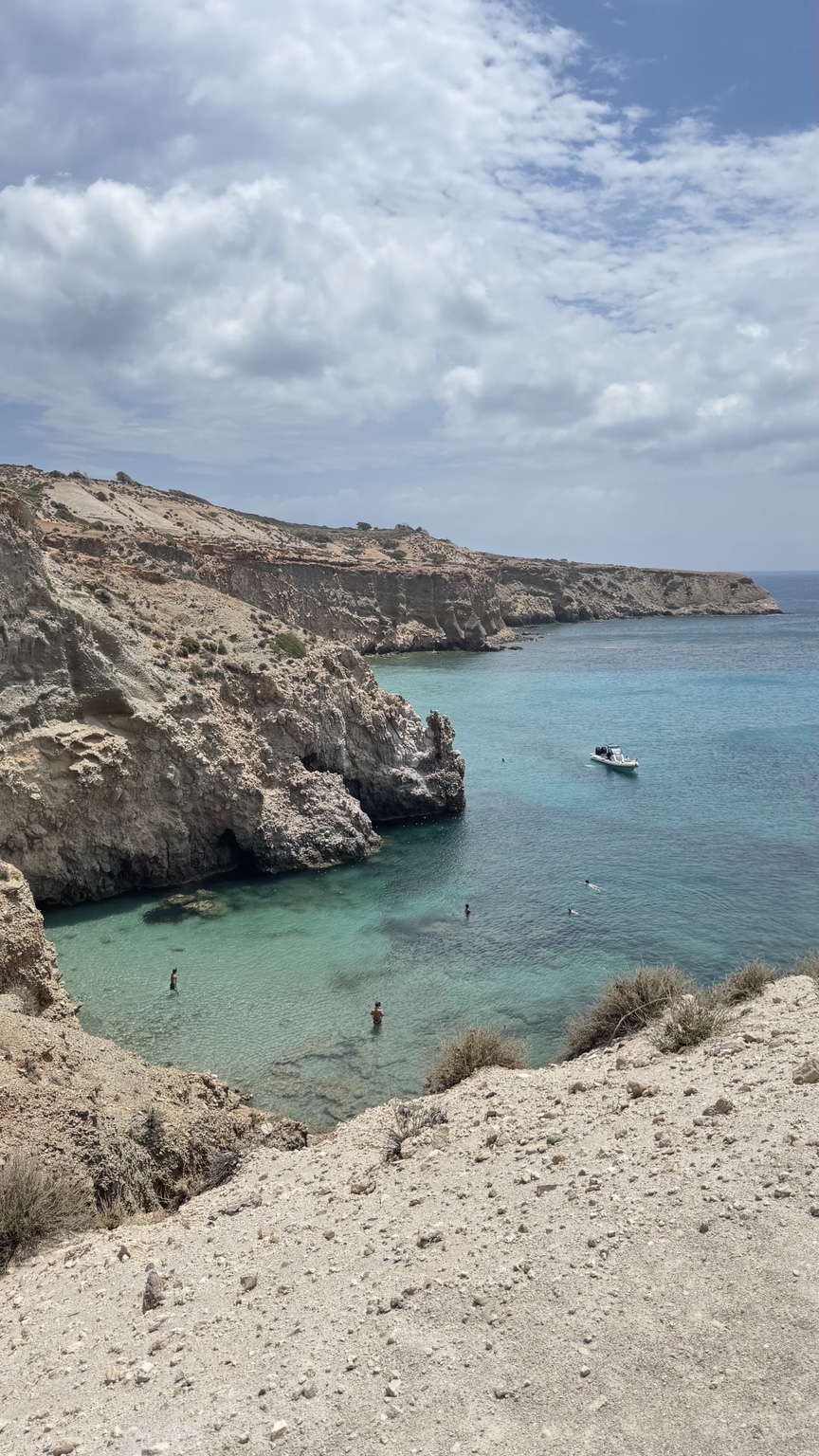 Turquoise water below the cliffs at Tsigrado Beach, Milos