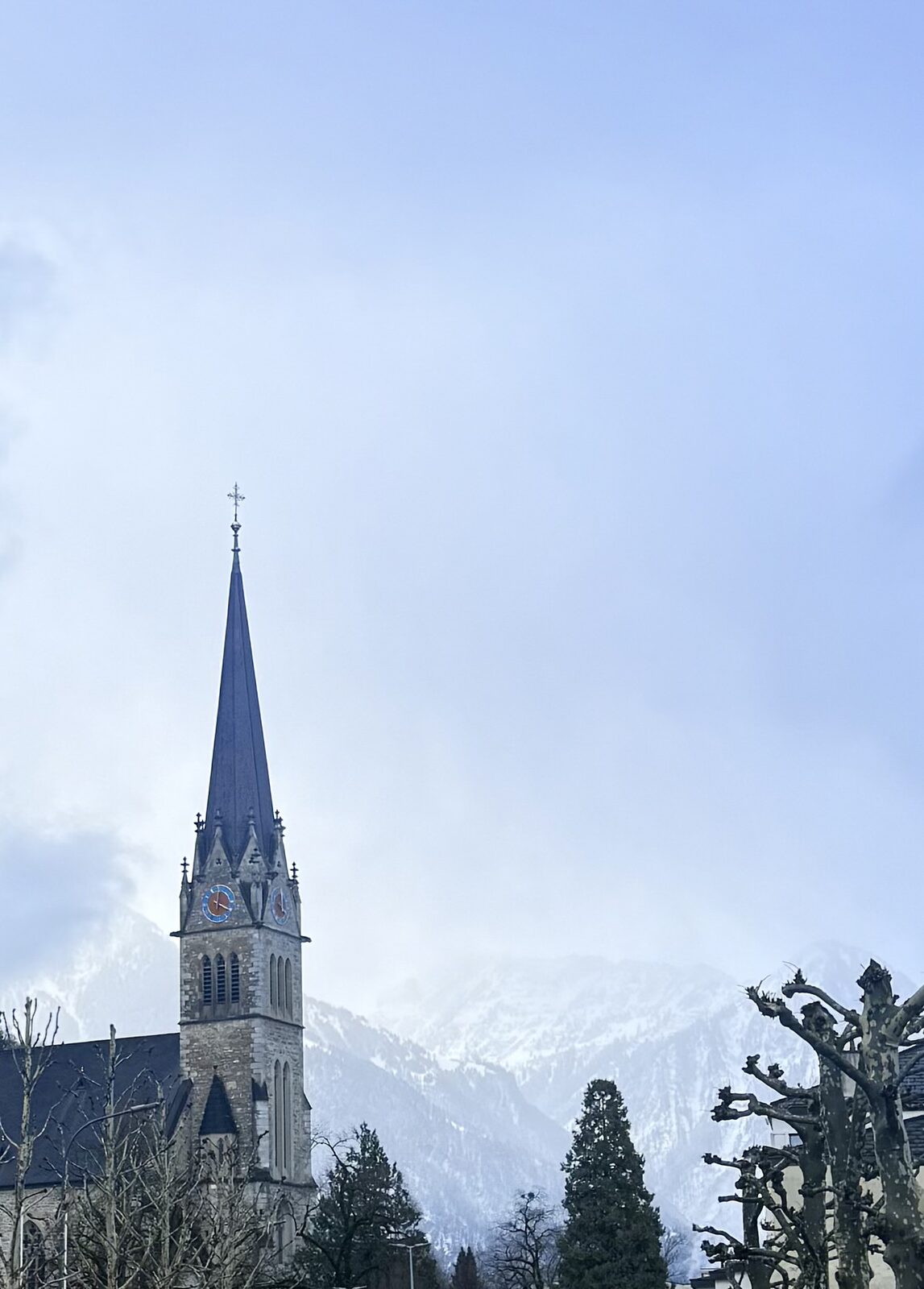 Vaduz Cathedral and the mountains in winter
