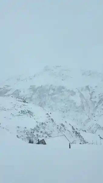 Snow-covered Alpine mountains seen from the Glacier Express, photographed by Libby